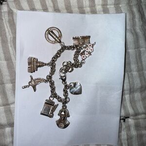 Silver DC charm bracelet.